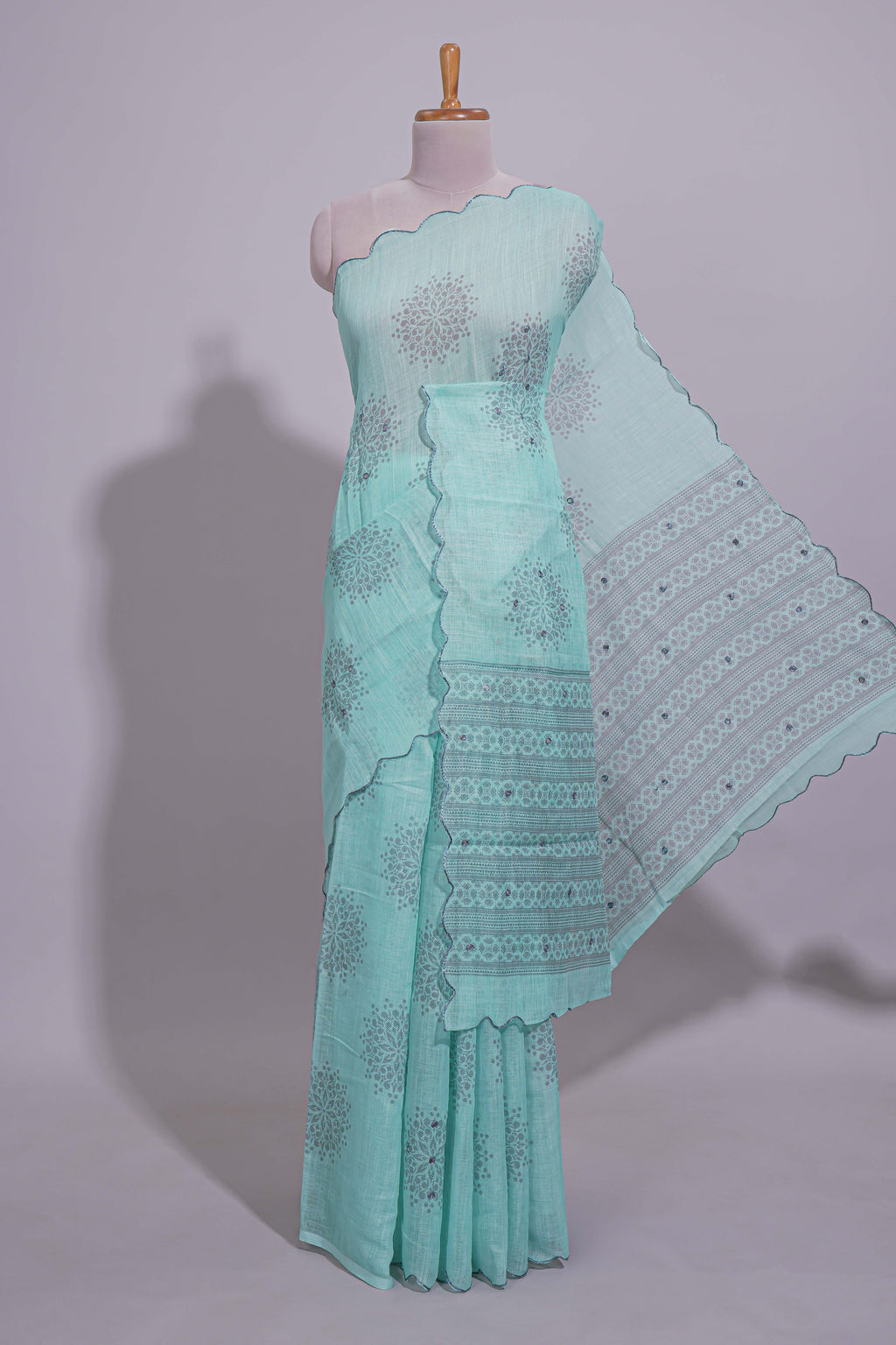 Pastel blue linen saree tree motifs and tiny sequin with scalloped border and matching blouse