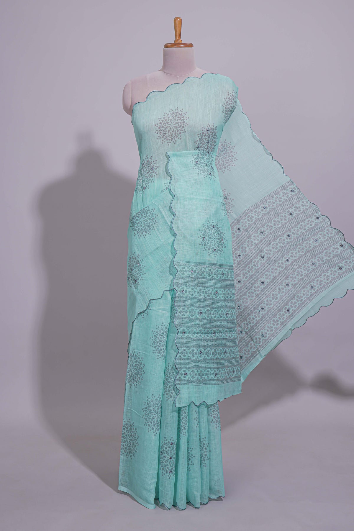 Pastel blue linen saree tree motifs and tiny sequin with scalloped border and matching blouse