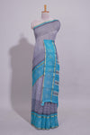 Checked linen saree with contrast blue border and pallu along with contrast printed blouse