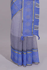 checked body linen saree with contrast border and pallu along with contrast printed blouse