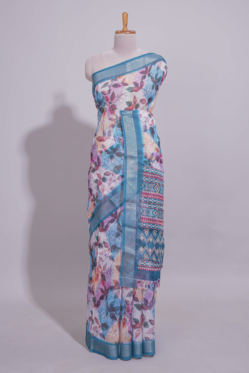 Floral printed linen cotton saree with contrast zari  border and geometric pallu along with matching blouse