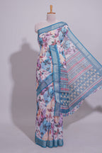 Floral printed linen cotton saree with contrast zari  border and geometric pallu along with matching blouse