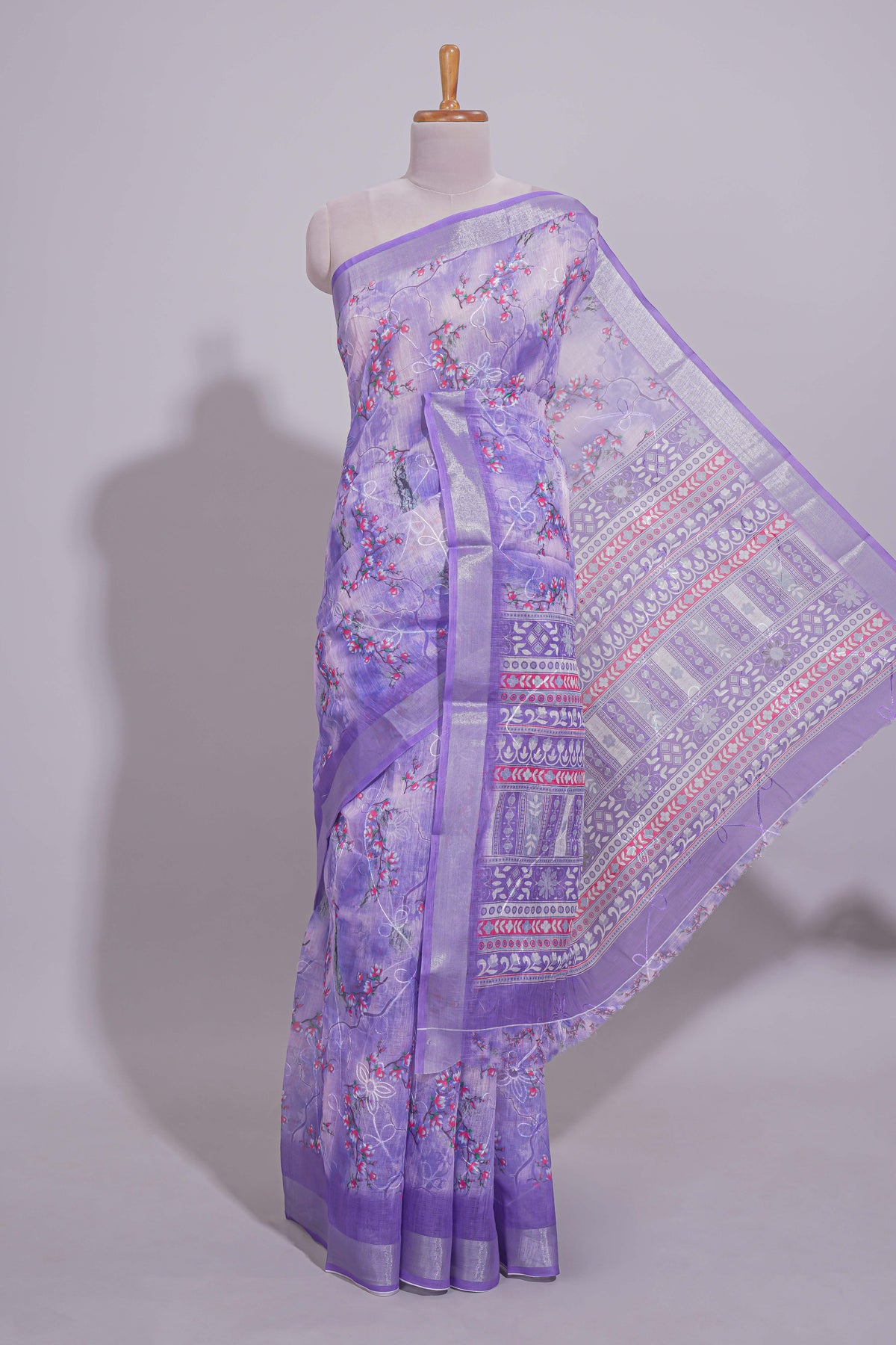 Purple Floral printed linen cotton saree with contrast zari  border and geometric pallu along with matching blouse