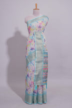 Ivory Floral linen cotton saree with contrast zari  border and self pallu along with contrast blouse