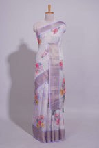 White Floral printed linen cotton saree with contrast zari  border and self pallu along with matching blouse