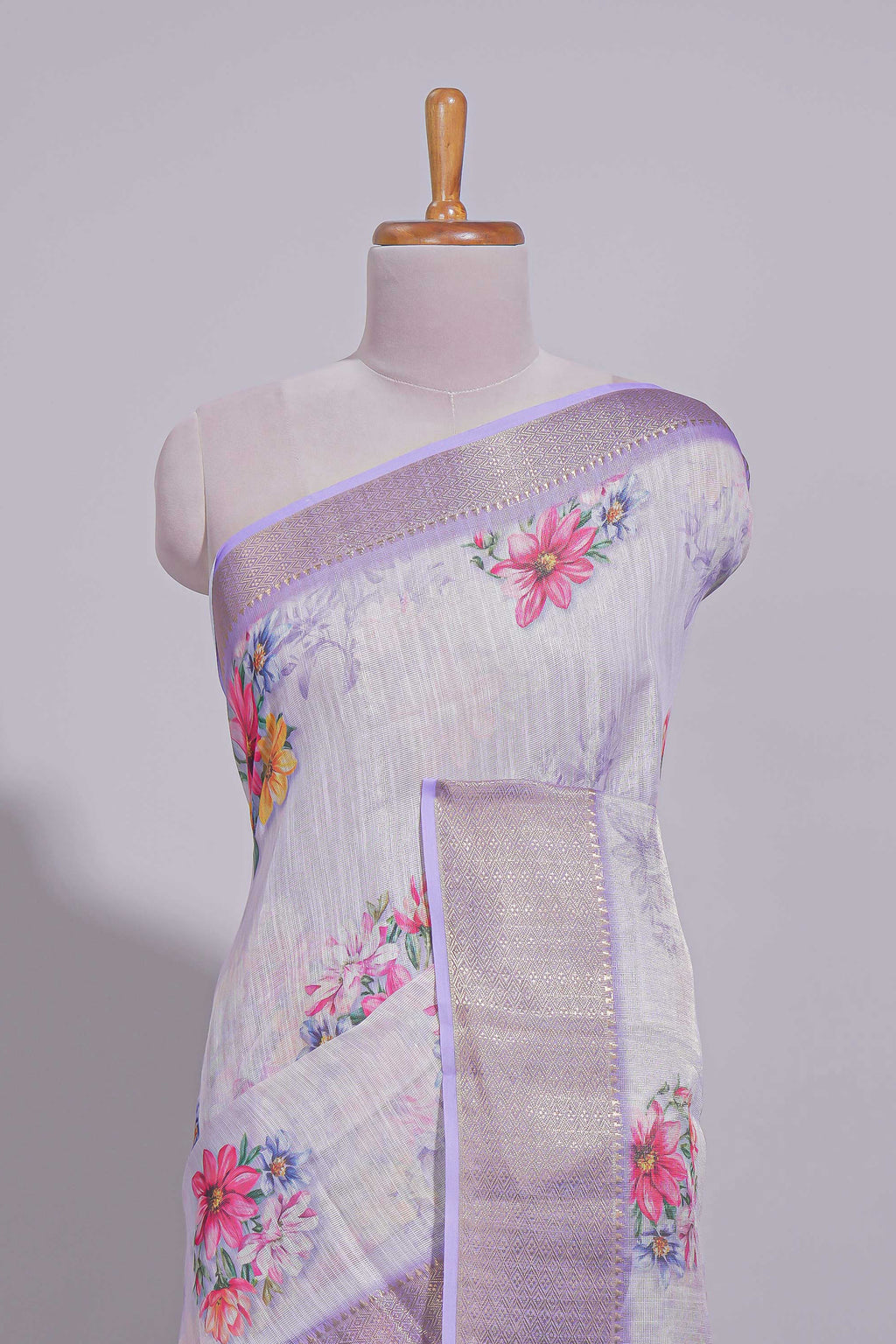 White Floral printed linen cotton saree with contrast zari  border and self pallu along with matching blouse
