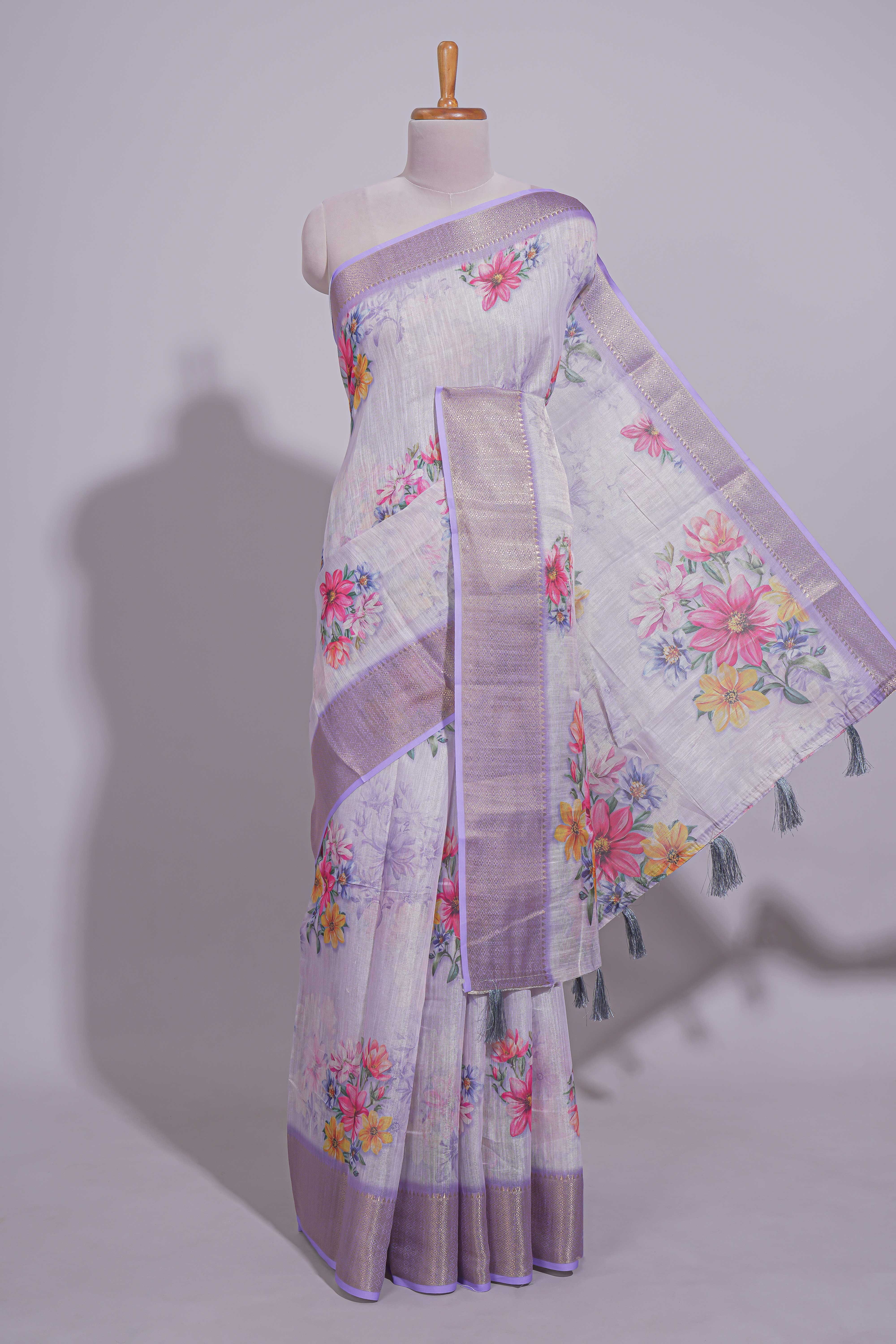 White Floral printed linen cotton saree with contrast zariborder and self pallu along with matching blouse