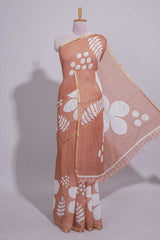 Brown linen saree with bold white floral and geometric prints finished with a subtle metallic border along with matching blouse