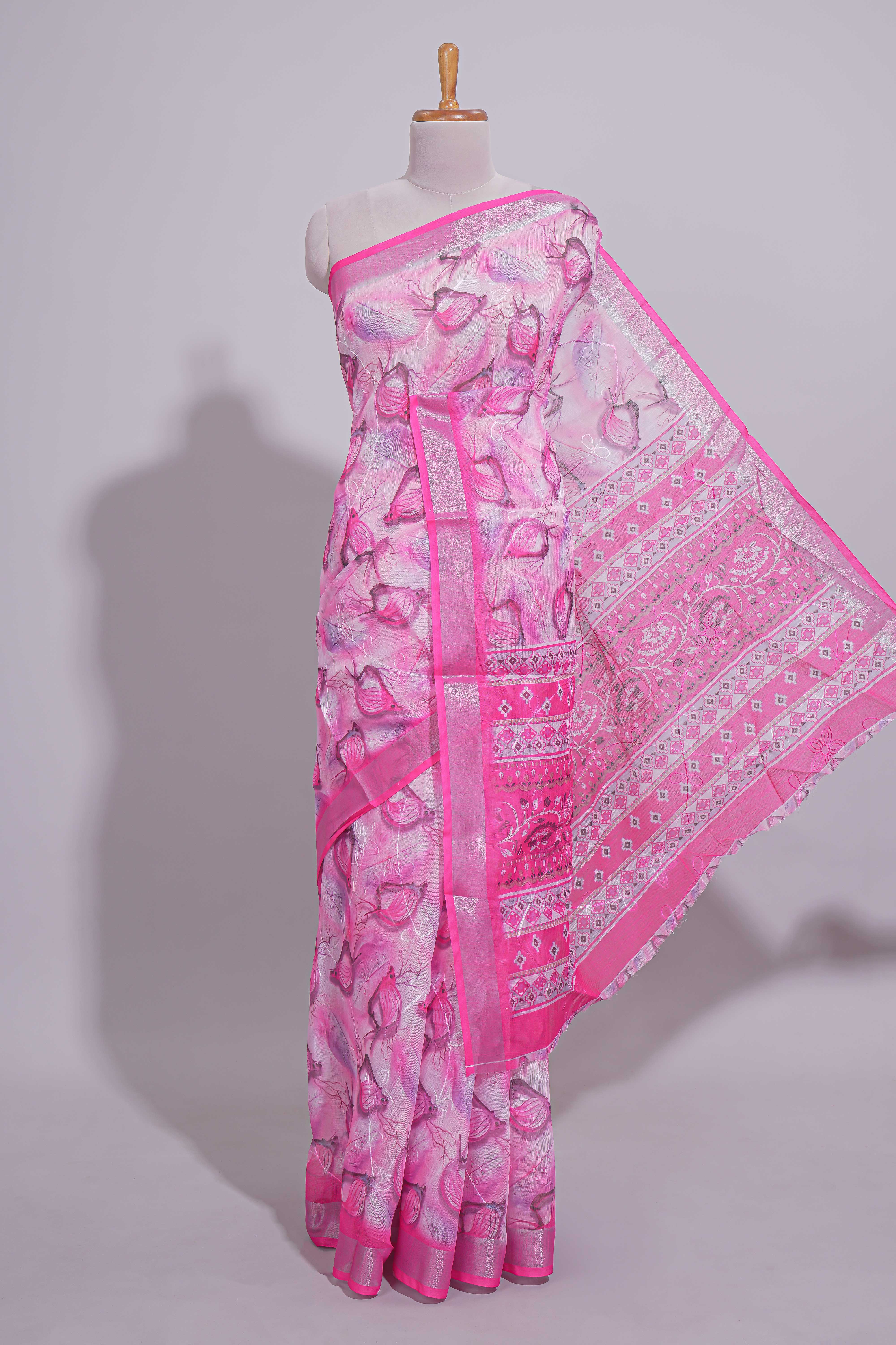 Pink Floral printed linen cotton saree with contrast zariborder and geometric pallu along with matching blouse