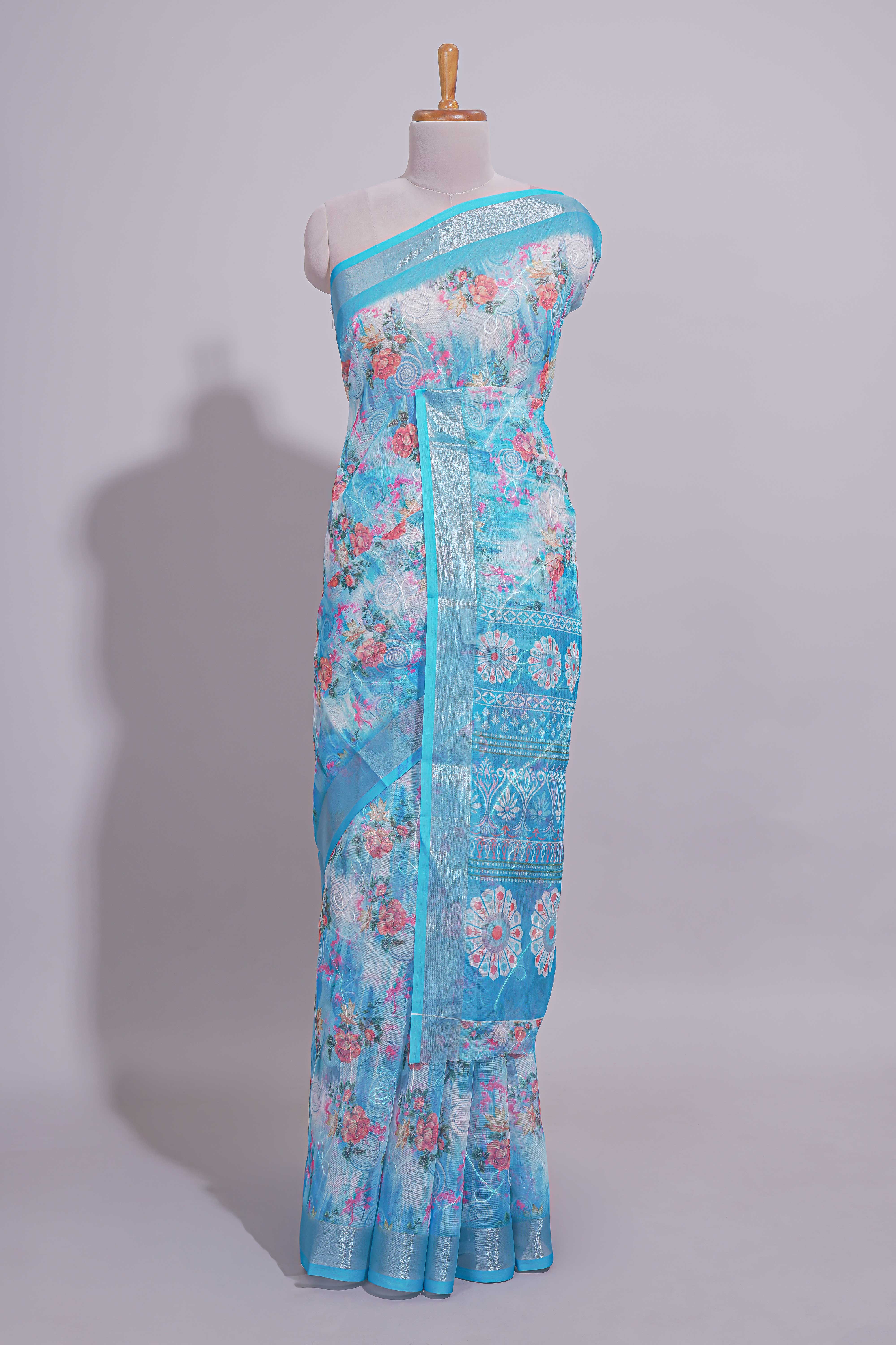 Blue Floral printed linen cotton saree with contrast zariborder and geometric pallu along with matching blouse