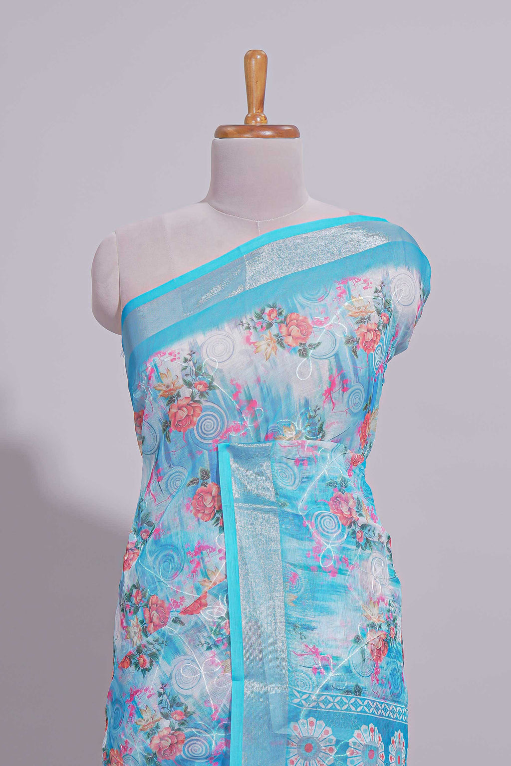 Blue Floral printed linen cotton saree with contrast zari  border and geometric pallu along with matching blouse