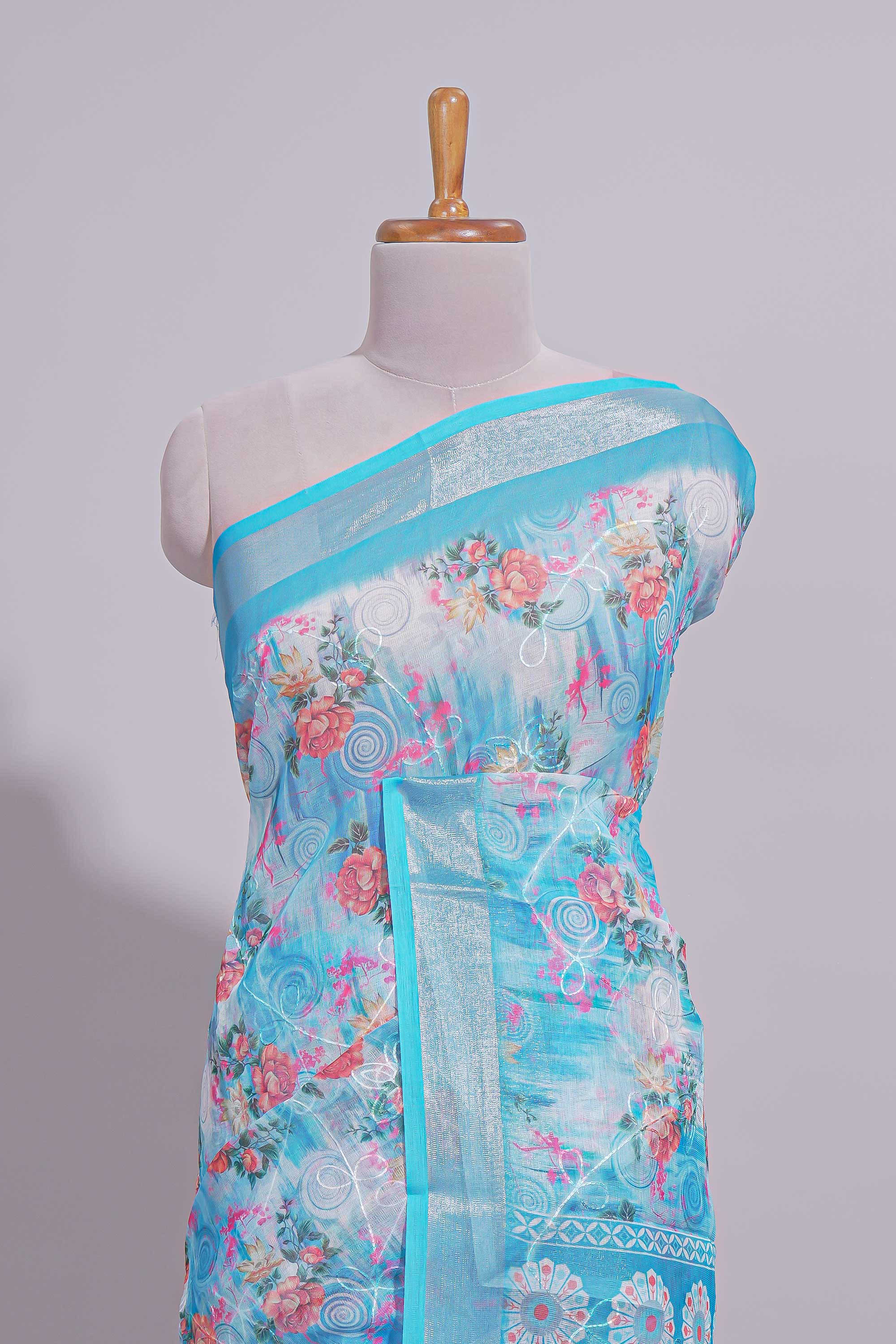 Blue Floral printed linen cotton saree with contrast zariborder and geometric pallu along with matching blouse