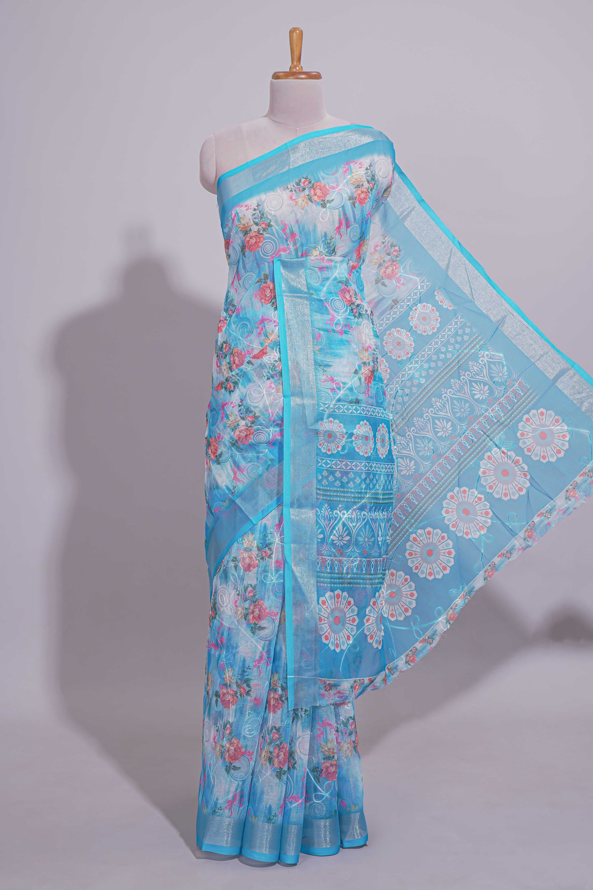 Blue Floral printed linen cotton saree with contrast zari  border and geometric pallu along with matching blouse