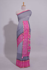Checked linen saree with contrast border and pallu along with contrast printed blouse