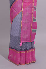 Checked linen saree with contrast border and pallu along with contrast printed blouse