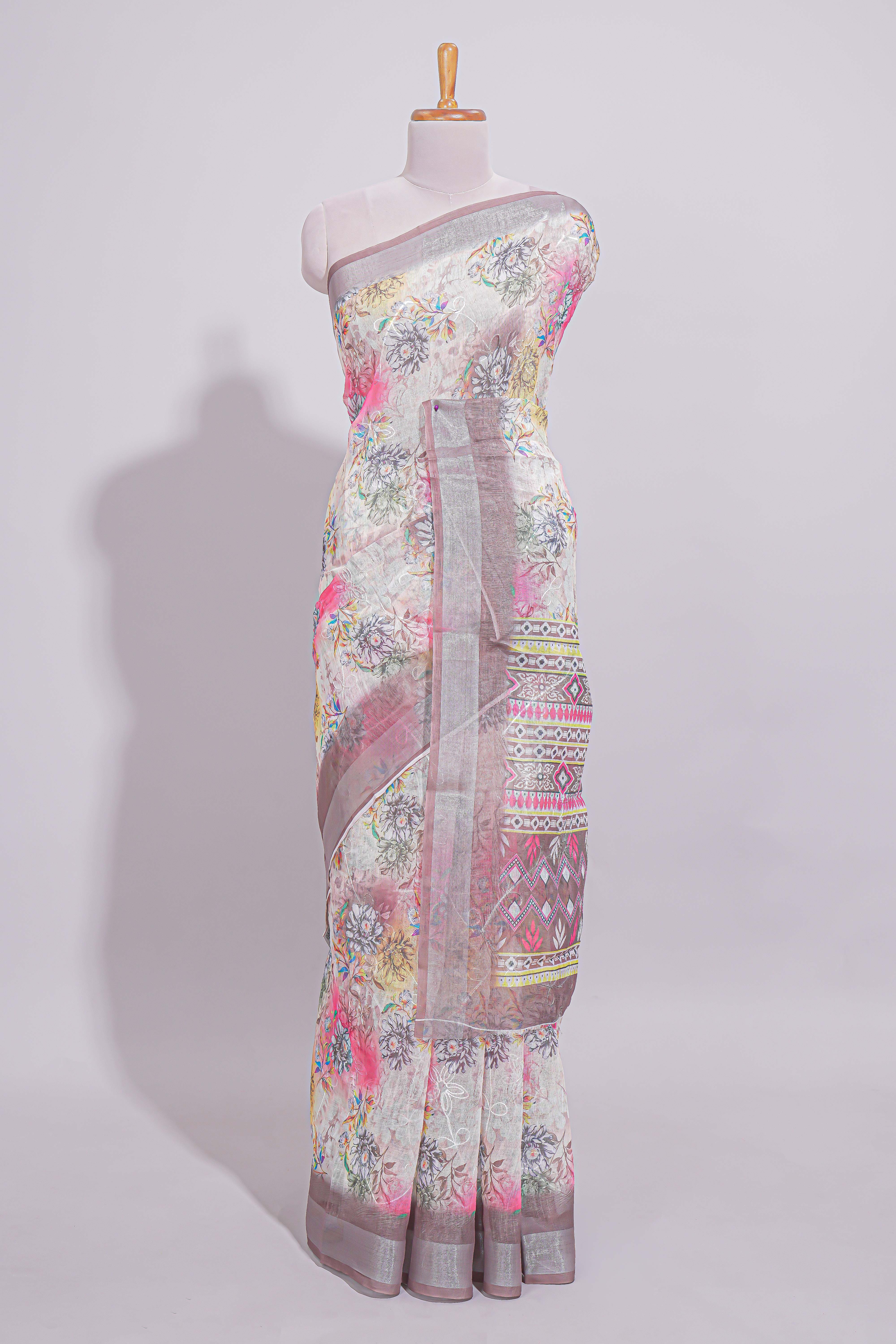 White Florallinen cotton saree with contrast zariborder and geometric pallu along with matching blouse