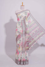 White Floral  linen cotton saree with contrast zari  border and geometric pallu along with matching blouse