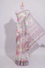 White Florallinen cotton saree with contrast zariborder and geometric pallu along with matching blouse