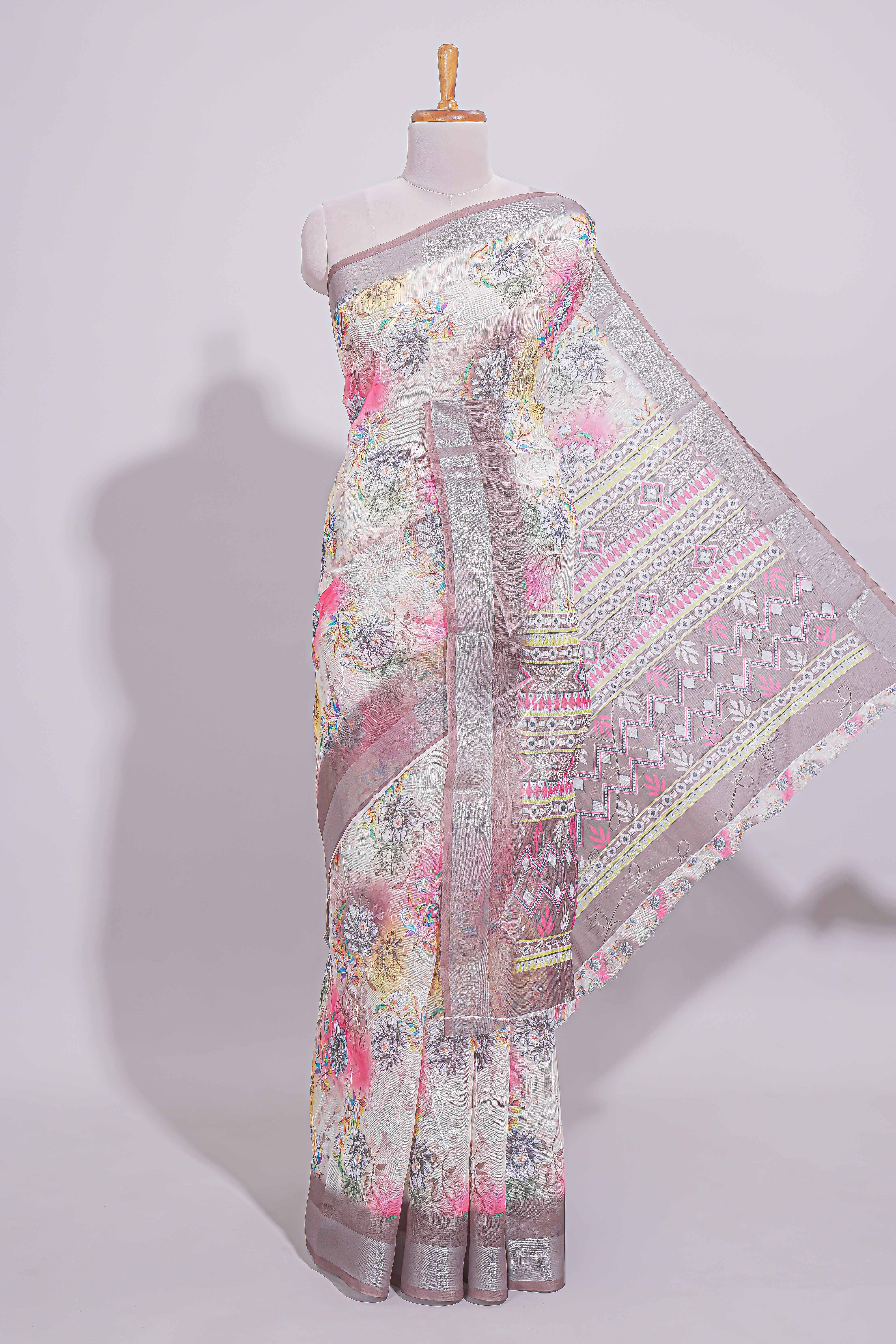 White Florallinen cotton saree with contrast zariborder and geometric pallu along with matching blouse