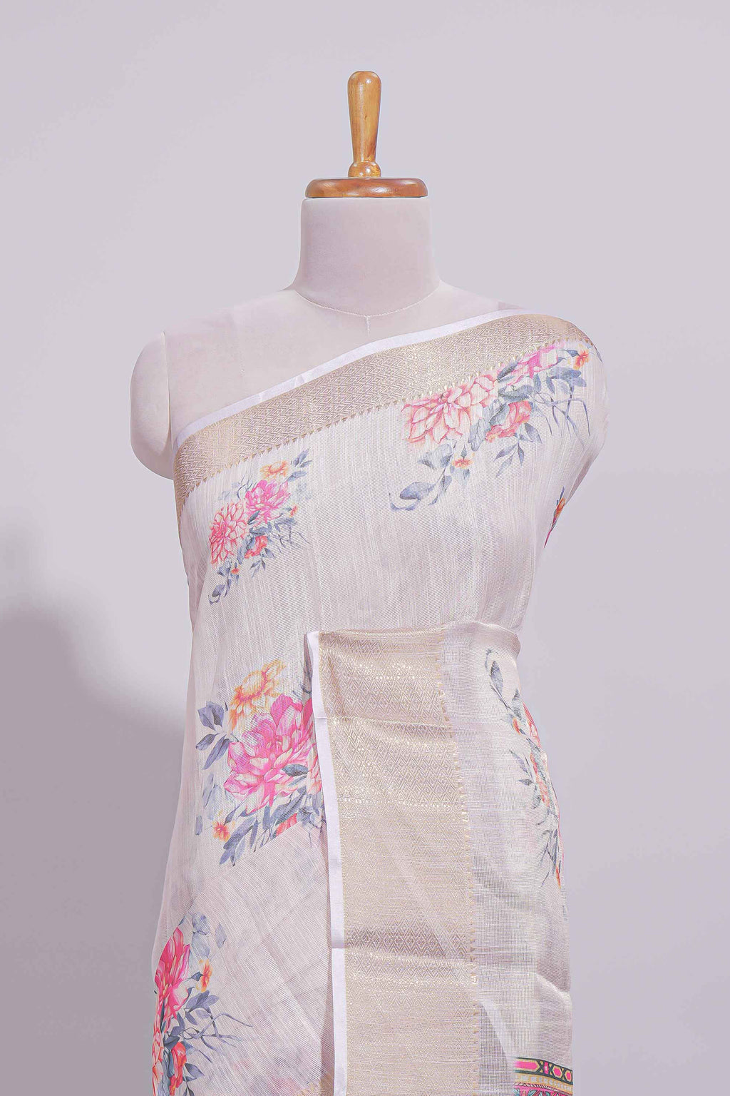 Ivory colour Floral printed linen cotton saree with contrast zari  border and geometric pallu along with matching blouse