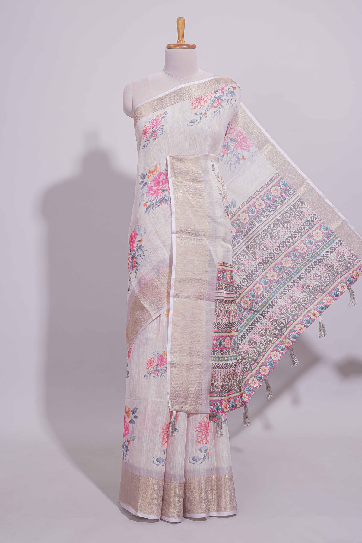 Ivory colour Floral printed linen cotton saree with contrast zari  border and geometric pallu along with matching blouse