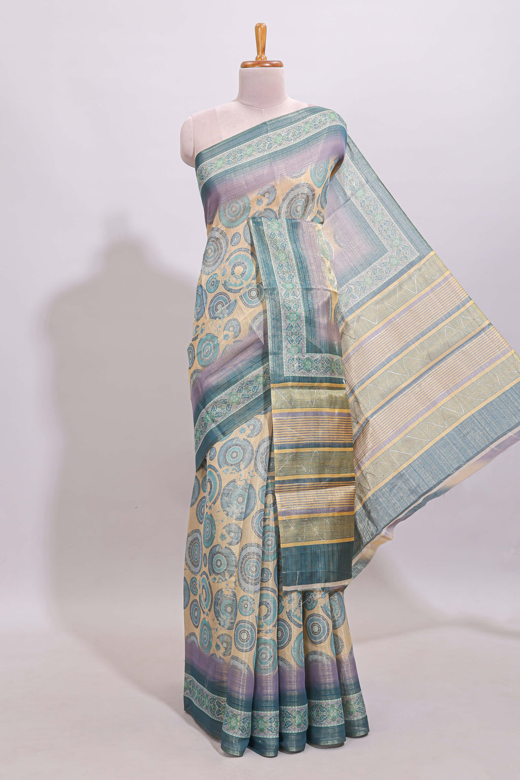 Beige colour linen cotton saree with geometric design body and contrast sea green border with geometric pallu along with matching blouse