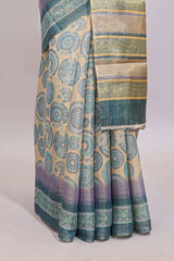 Beige colour linen cotton saree with geometric design body and contrast sea green border with geometric pallu along with matching blouse