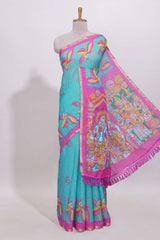 Blue stylized bird motifs linen cotton saree with contrast border and blouse