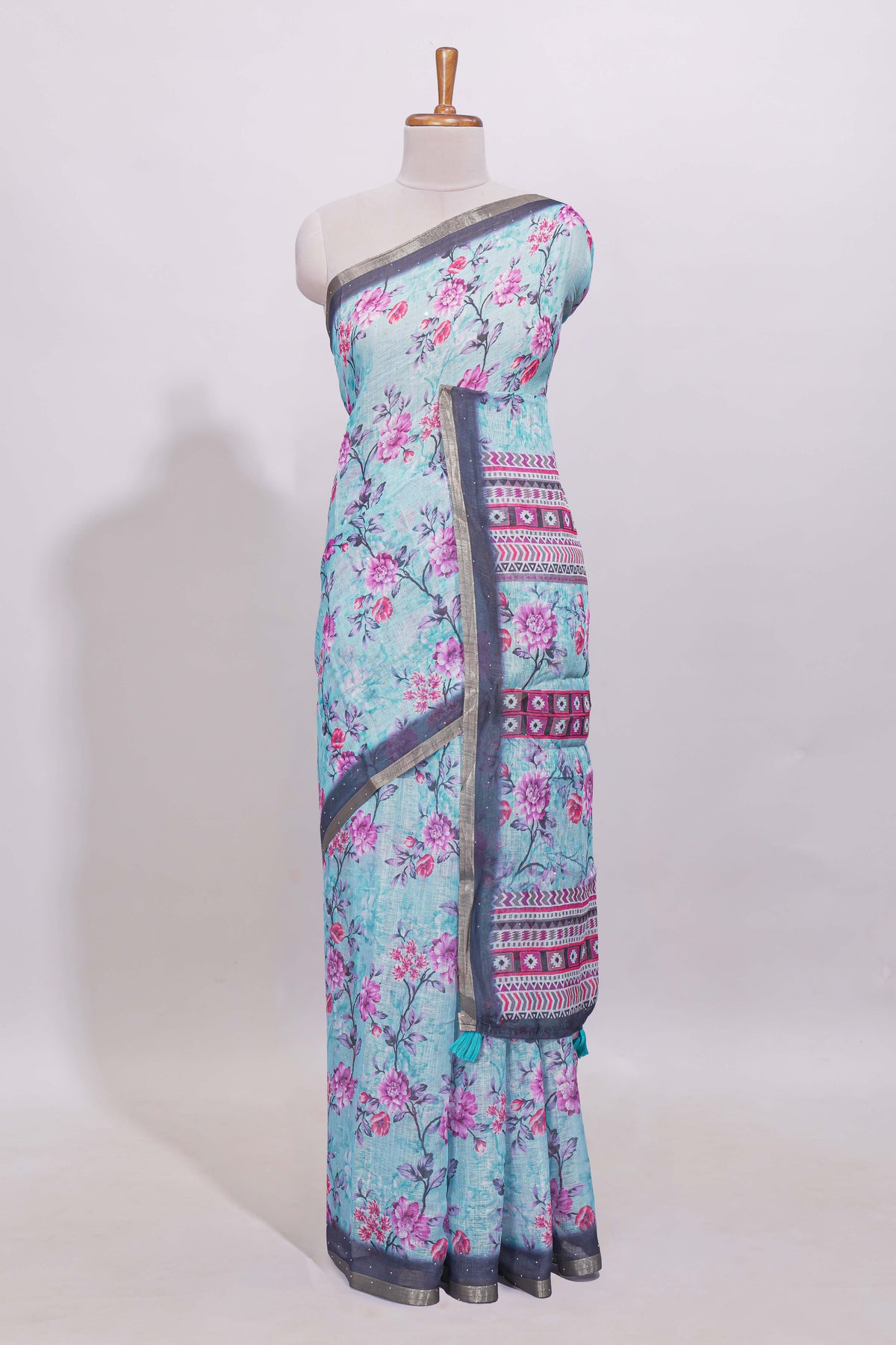 Blue floral designed linen cotton saree with contrast border and matching blouse