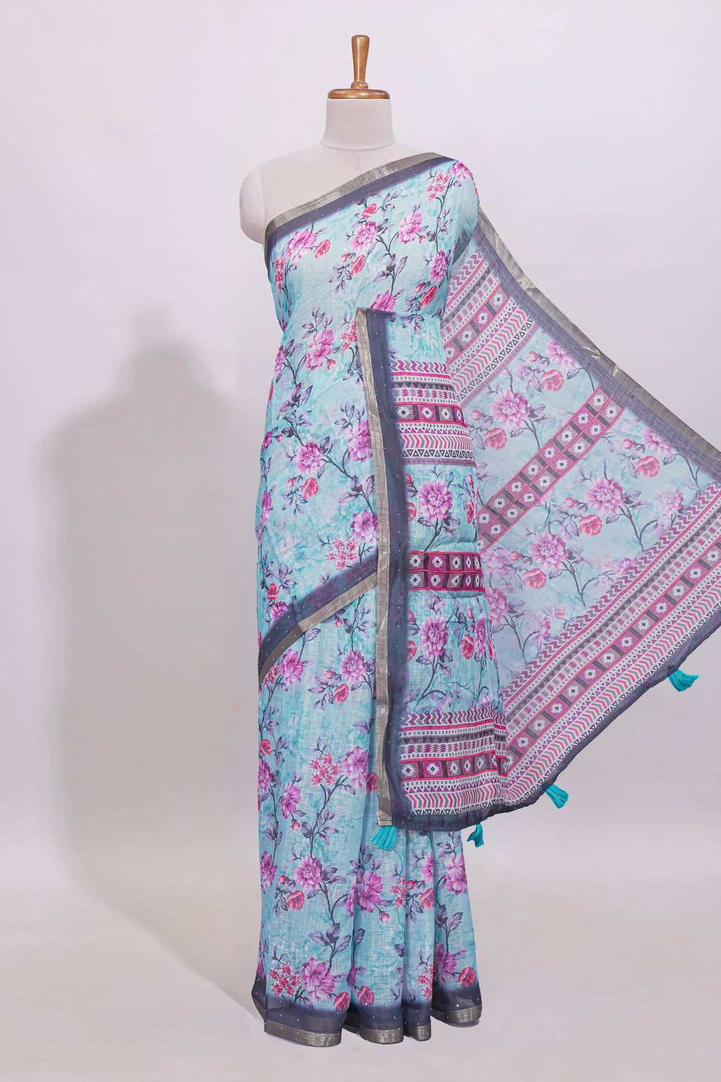 Blue floral designed linen cotton saree with contrast border and matching blouse