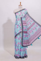 Blue floral designed linen cotton saree with contrast border and matching blouse