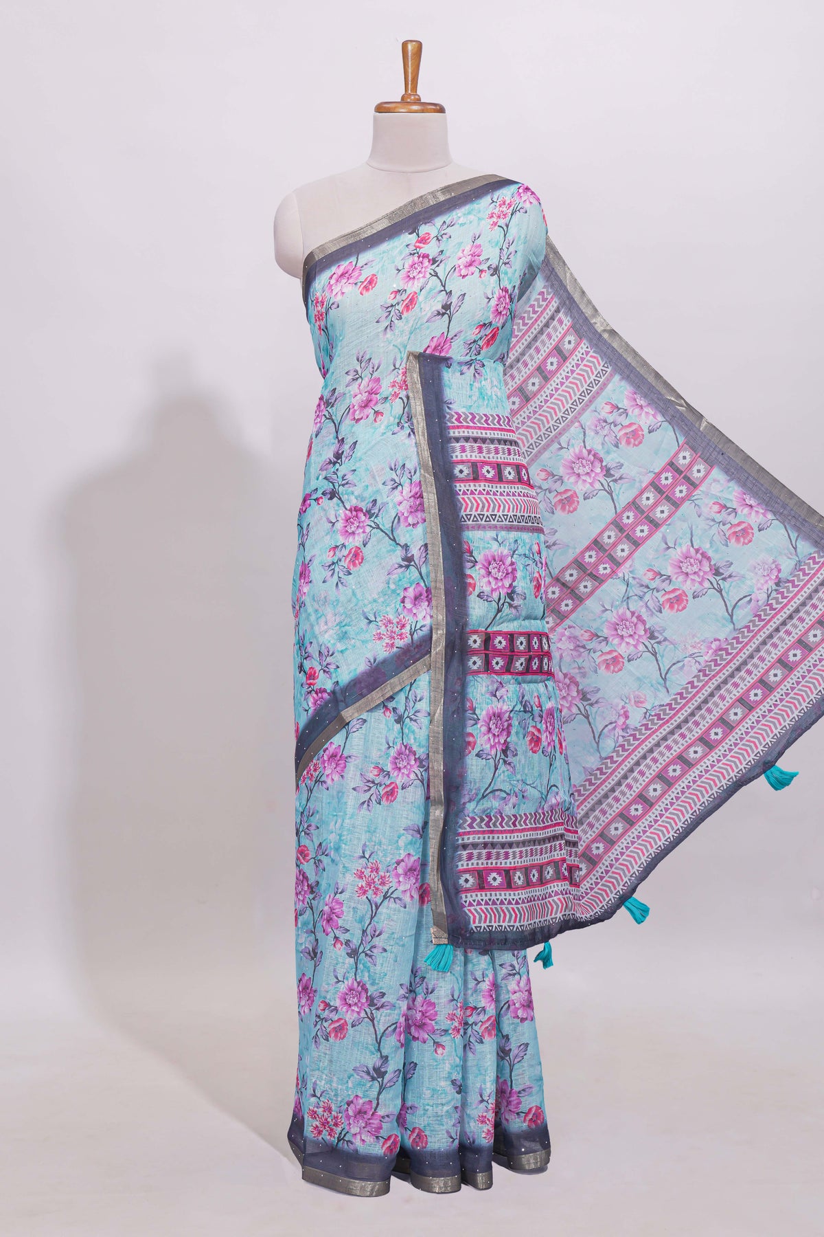 Blue floral designed linen cotton saree with contrast border and matching blouse