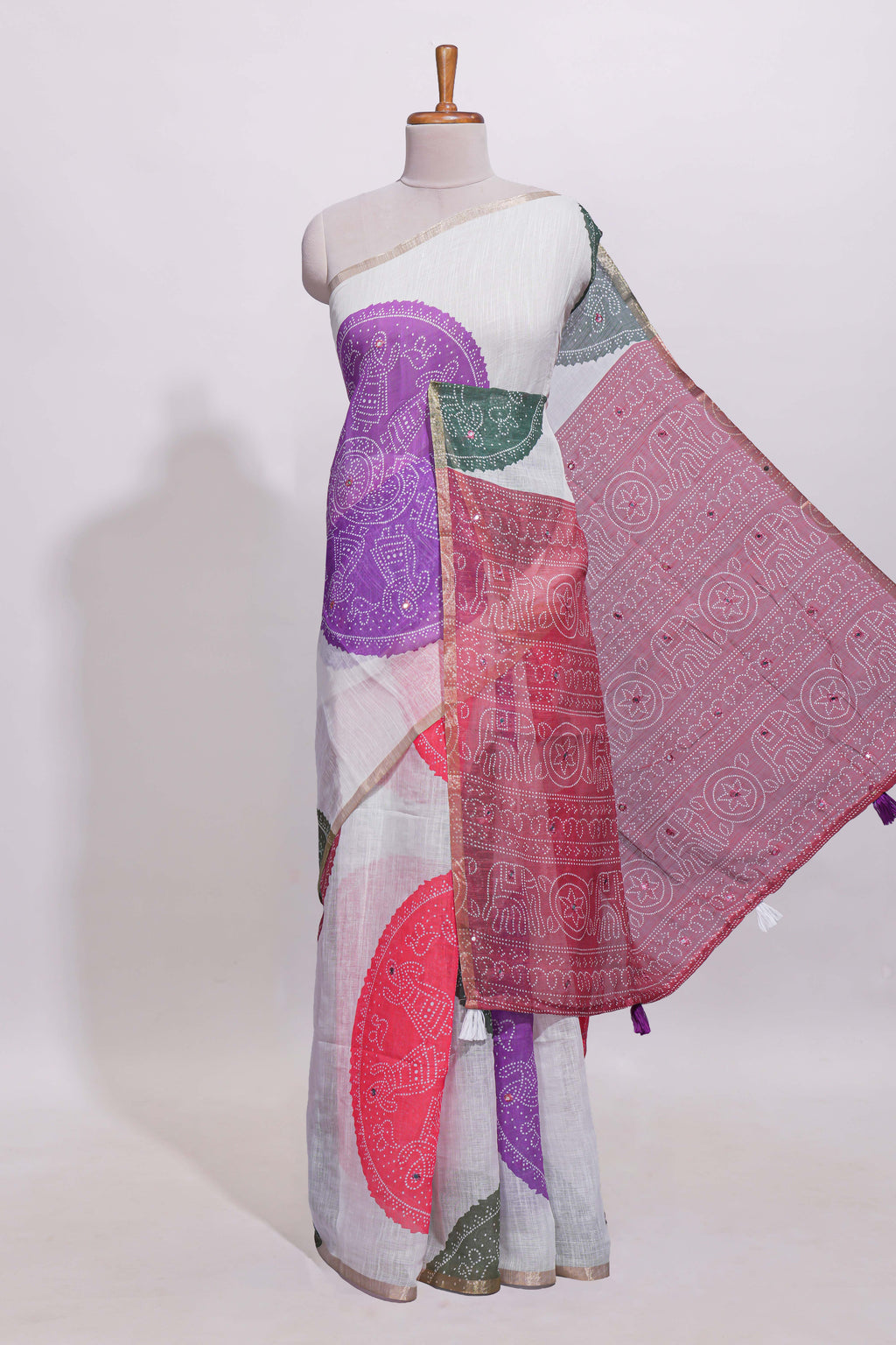 White bandhini designed linen cotton saree with self border and contrast blouse