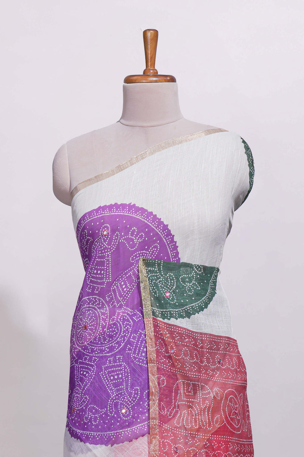 White bandhini designed linen cotton saree with self border and contrast blouse