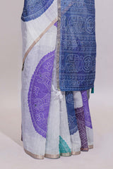 White bandhini designed linen cotton saree with self border and contrast blue blouse