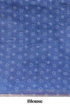 White bandhini designed linen cotton saree with self border and contrast blue blouse