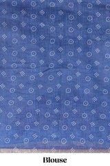 White bandhini designed linen cotton saree with self border and contrast blue blouse