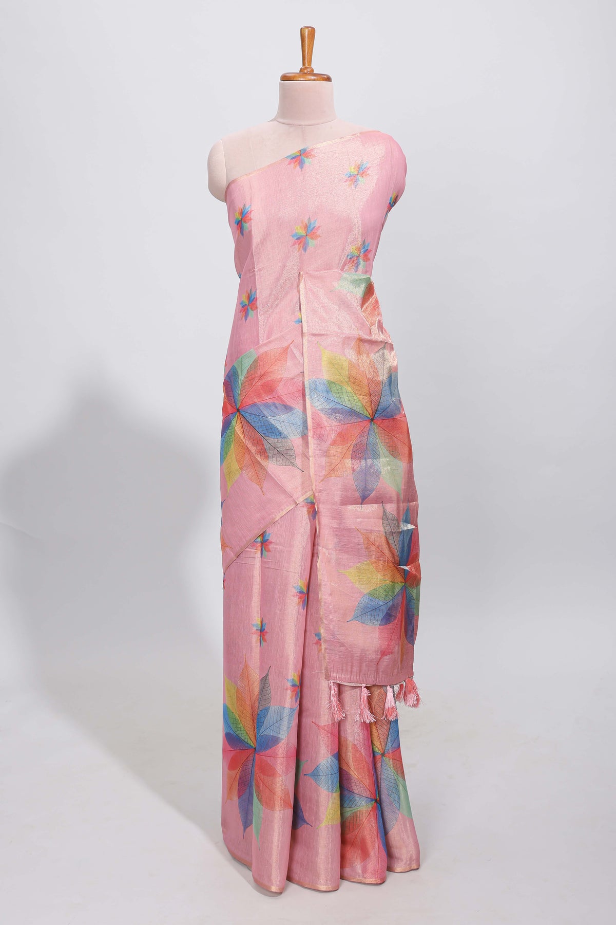 Peach floral design motifs linen cotton saree with self zari border and matching printed blouse