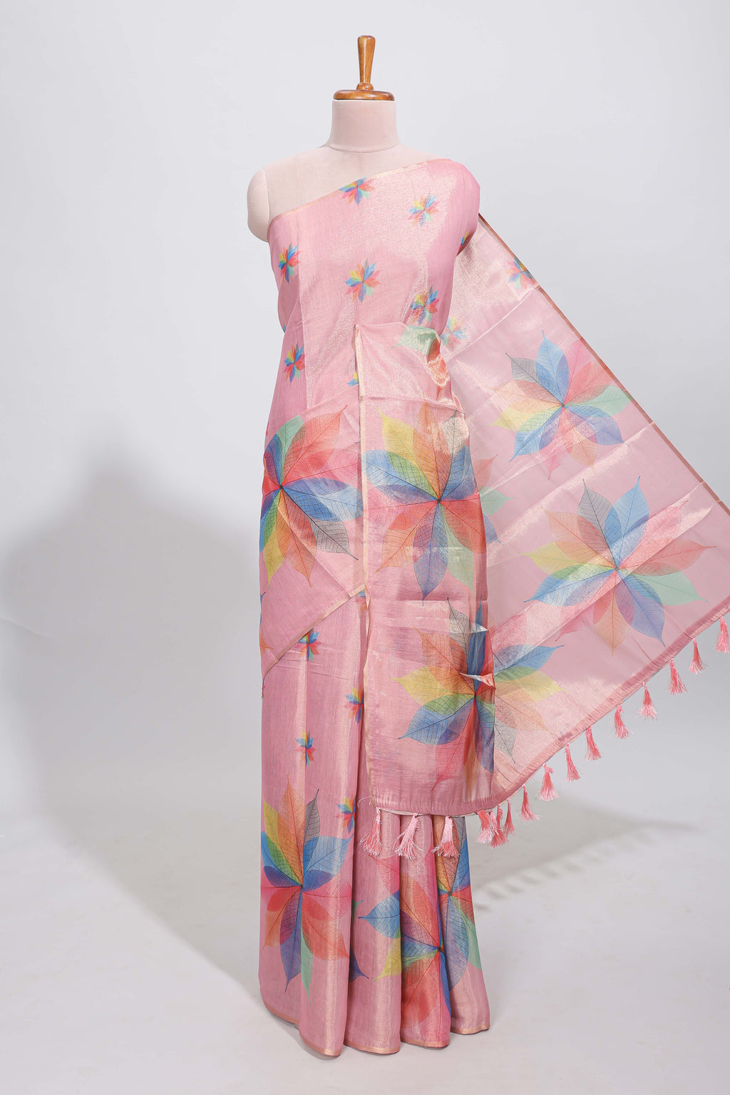 Peach floral design motifs linen cotton saree with self zari border and matching printed blouse