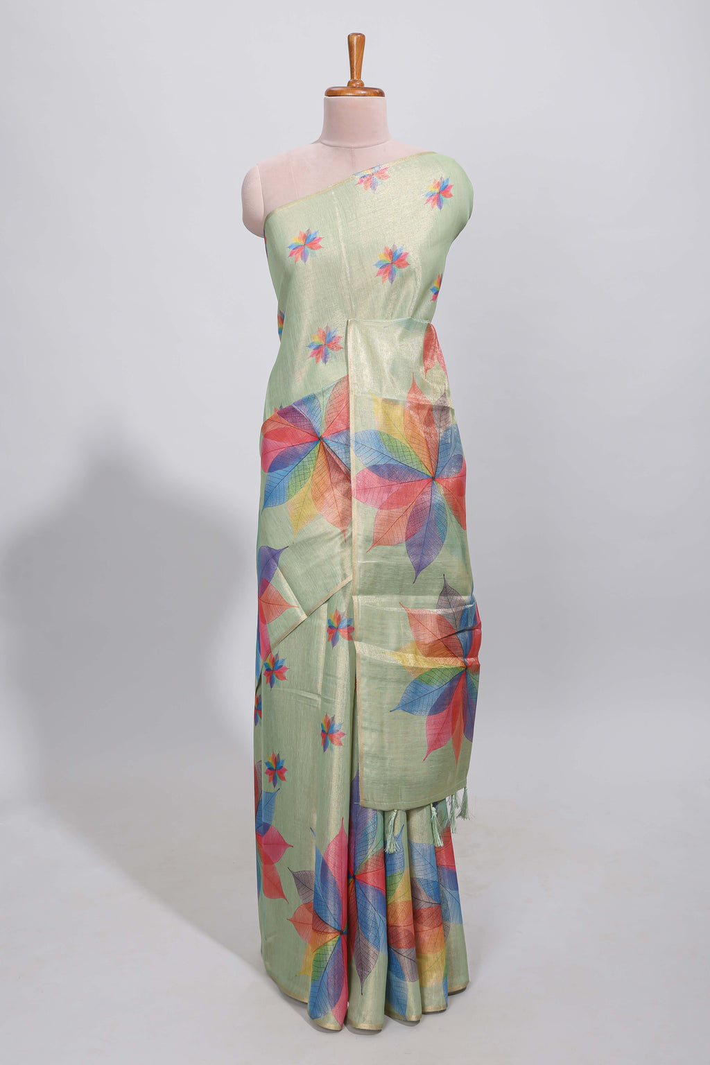 Green floral design motifs linen cotton saree with self zari border and matching printed blouse