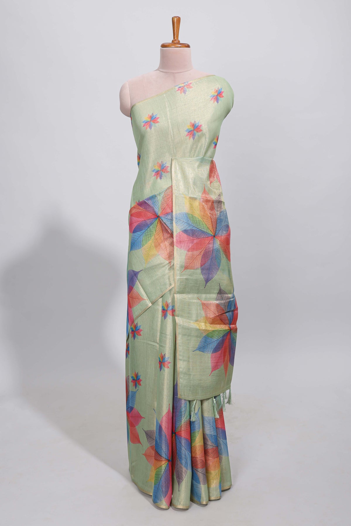 Green floral design motifs linen cotton saree with self zari border and matching printed blouse