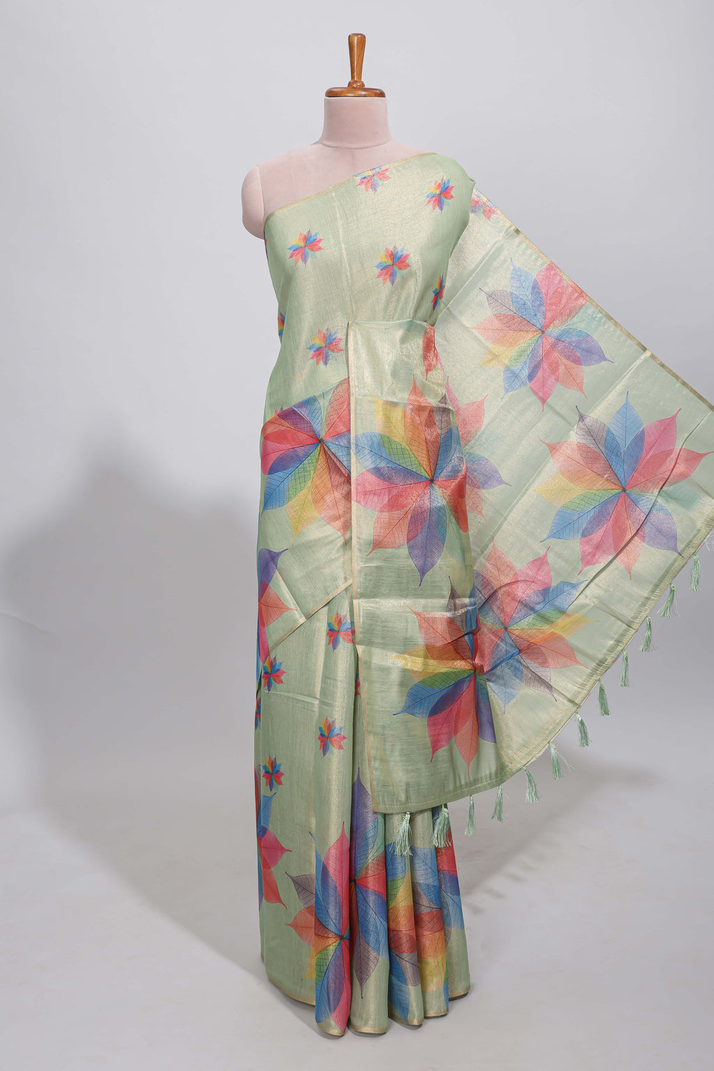 Green floral design motifs linen cotton saree with self zari border and matching printed blouse