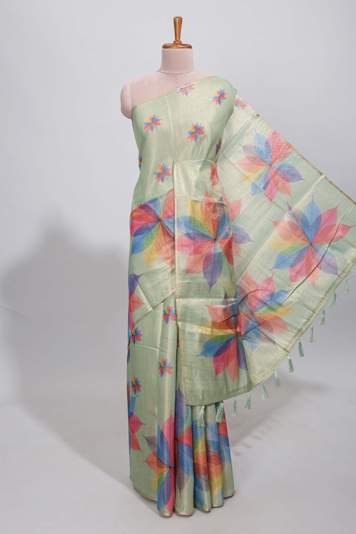 Green floral design motifs linen cotton saree with self zari border and matching printed blouse