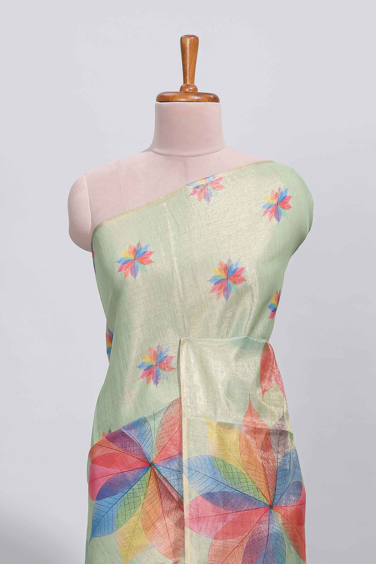 Green floral design motifs linen cotton saree with self zari border and matching printed blouse