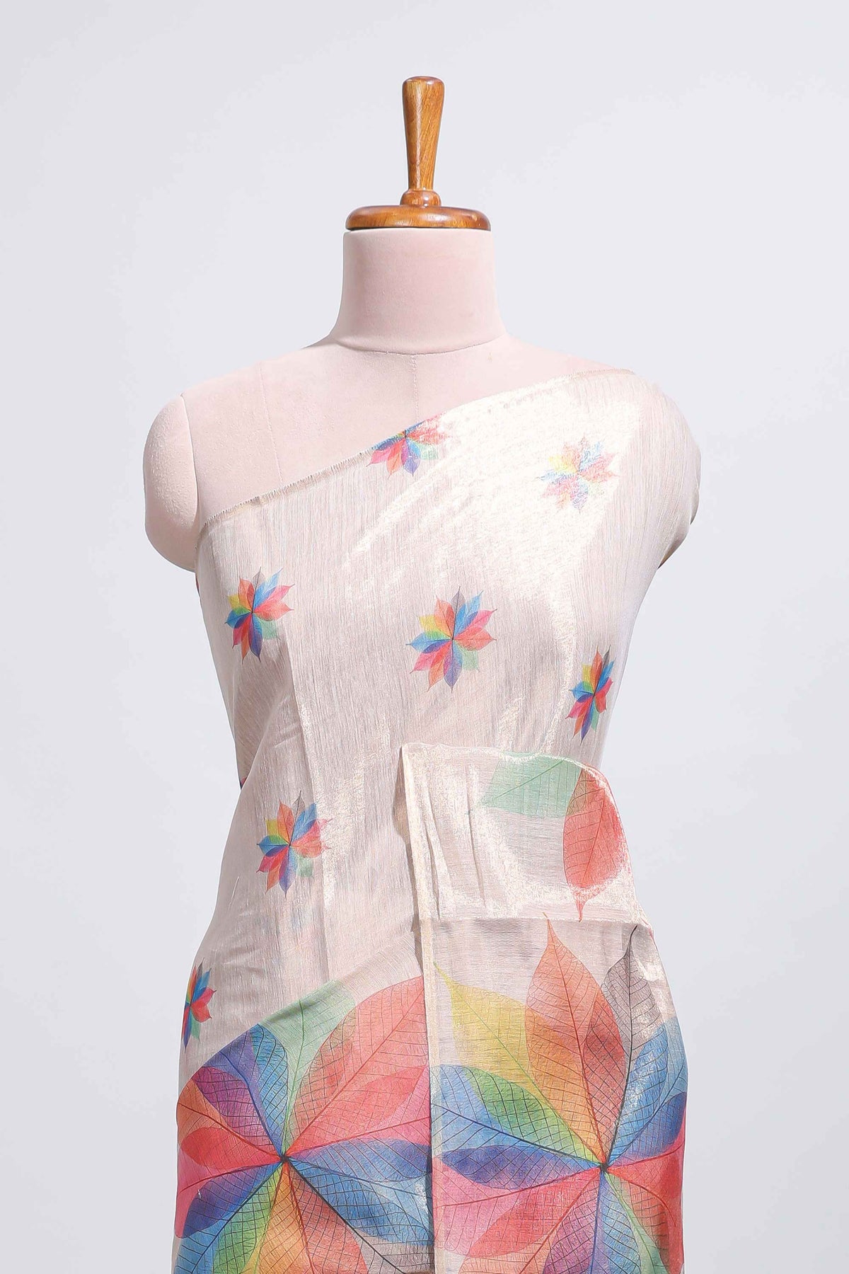 Beige floral design motifs linen cotton saree with self zari border and matching printed blouse