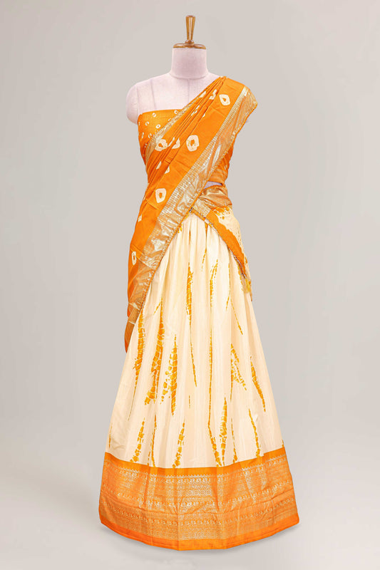 Cream dola silk bandhani designer lehenga with contrast blouse and dhavani