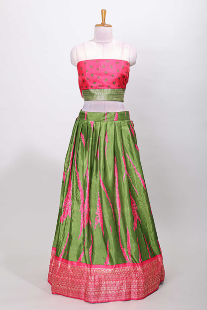 Green dola silk bandhani designer lehenga with contrast blouse and dhavani