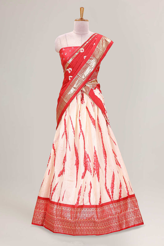 Cream dola silk bandhani designer lehenga with contrast blouse and dhavani