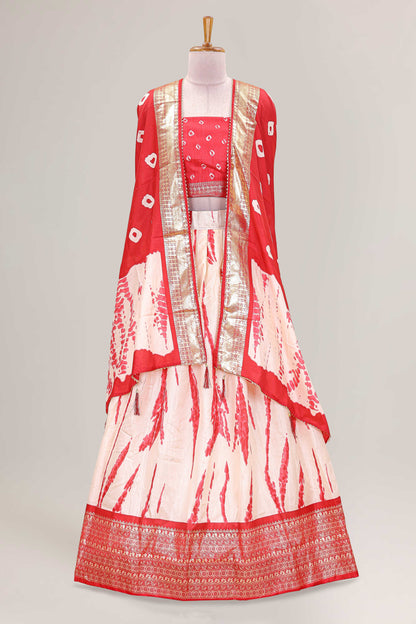 Cream dola silk bandhani designer lehenga with contrast blouse and dhavani