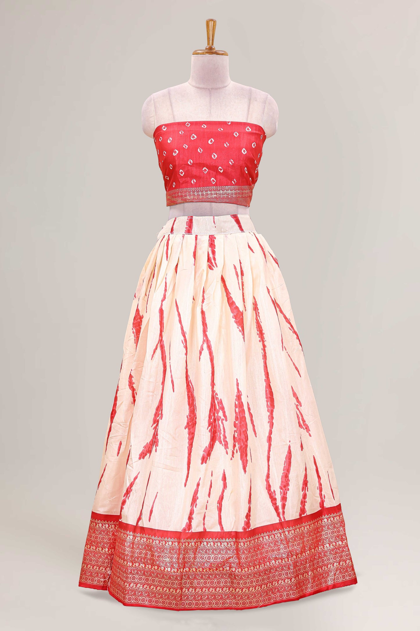 Cream dola silk bandhani designer lehenga with contrast blouse and dhavani